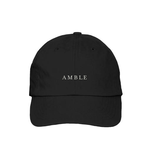 Black cap with 'AMBLE' logo on a white background